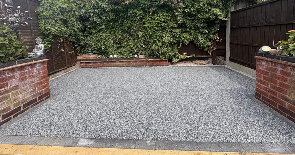 Sterling Silver Resin Patio in Leicester with single grey block paving border.